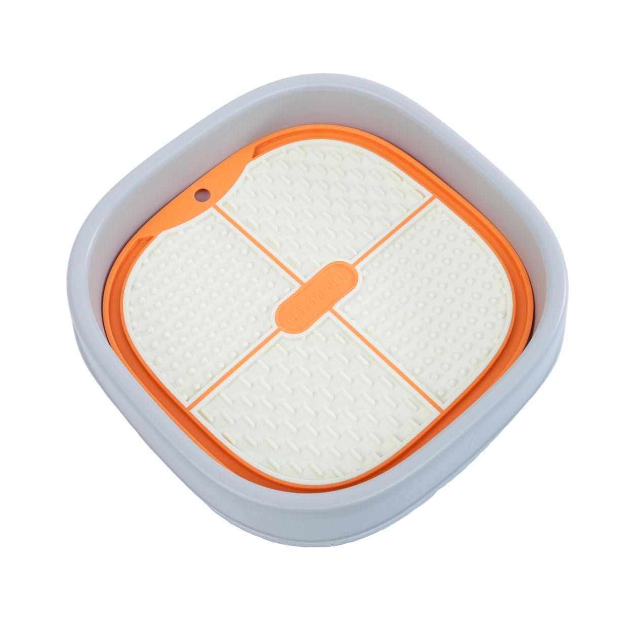 a orange lick mat is set up on a lick holder
