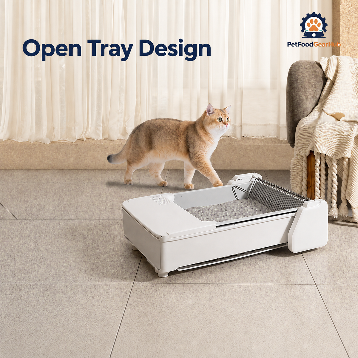 White open automatic litter tray with a metal rake and brown cat walking nearby in a softly lit living room.
