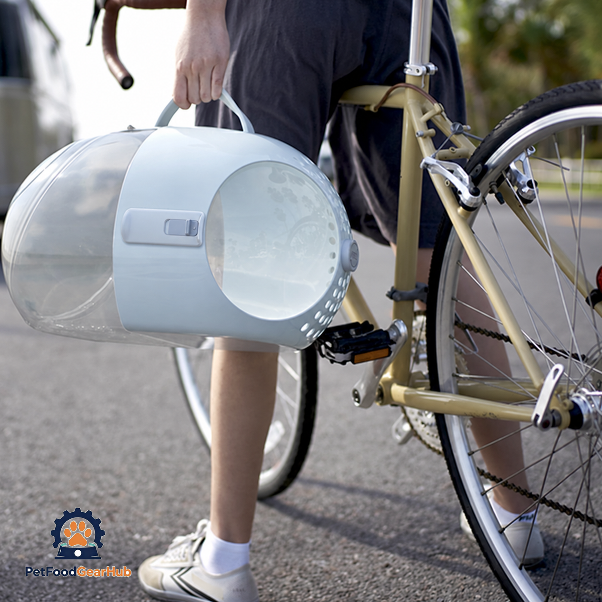 Person Holding Transparent PetFoodGearHub Capsule Cat Carrier | PetFoodGearHub