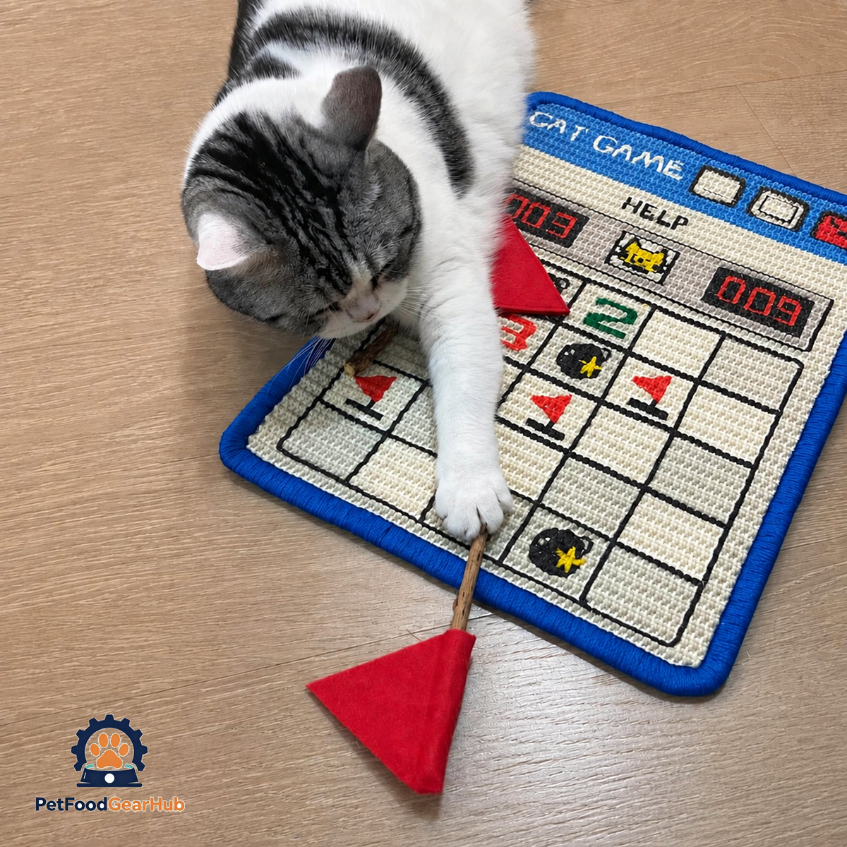 Cat Pawing at Red Flag Toy Beside Minesweeper Cat Scratcher | Cute Cat Toys | PetFoodGearHub